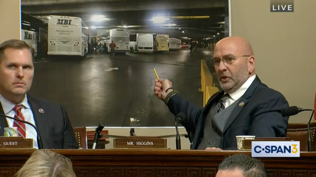 ​Congressman Clay Higgins gestures at some buses that he believes are full of FBI operatives