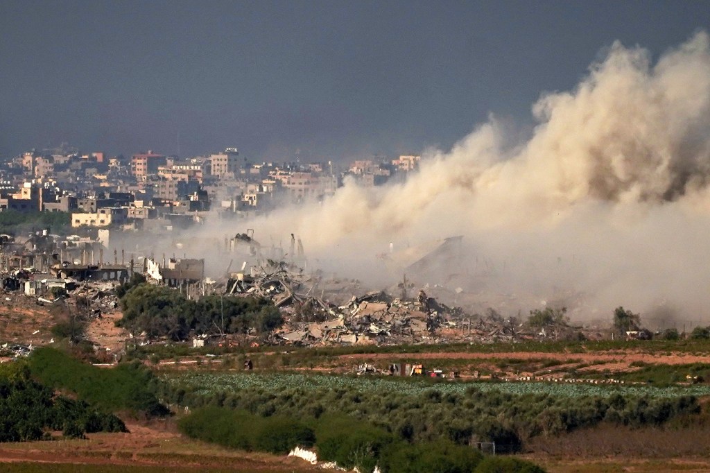 In this photograph taken near the Israeli border with the Gaza Strip a large plume of smoke rises over over Beit Hanoun in Northern Gaza after an Israeli air strike is seen, on November 16, 2023 from Sedorot, Israel.