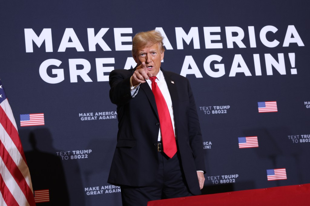 Republican presidential candidate, former President Donald Trump arrives at a campaign event at the Hyatt Hotel on December 13, 2023 in Coralville, Iowa.