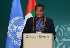 Samoa’s Toeolesulusulu Cedric Schuster speaks at a podium