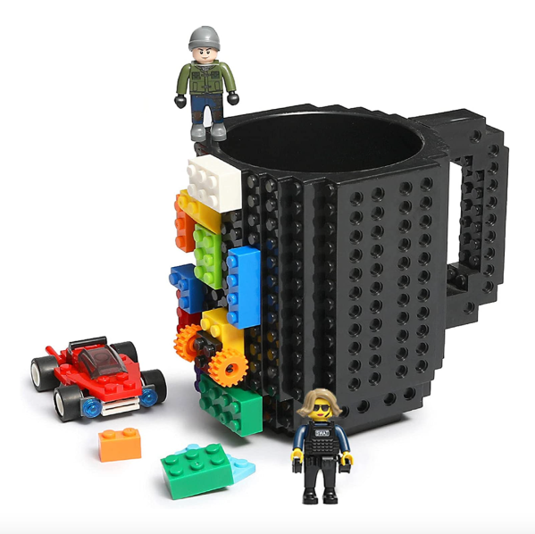 Coffee mug with blocks and toy characters.