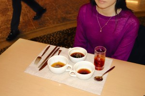 Woman sat alone attable eating