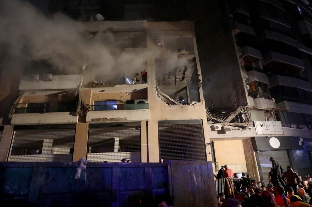 Firefighters and civil defense are seen in a damaged building that was allegedly targeted by an Israeli drone strike on January 2, 2024 in Dahiyeh, a suburb of Beirut, Lebanon.