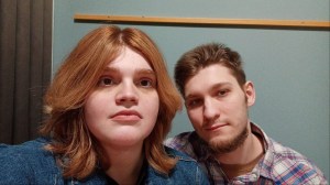 Olga, LGBTQ+ russia – red-haired woman posing next to a dirty-blonde guy beard and a beard.