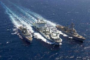 The USS Truxtun, right, and Canadian ships MV Asterix, middle, and Montreal conduct a replenishment in the Red Sea, May 3, 2023.