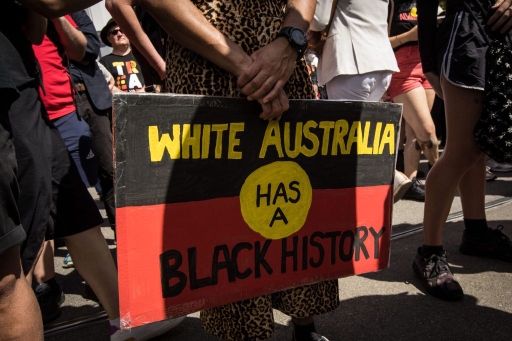 Protestors gather on Victorian Parliament steps for the January 26, 2023 Invasion Day Rally. Photo by Darrian Traynor / Contributor via Getty.​