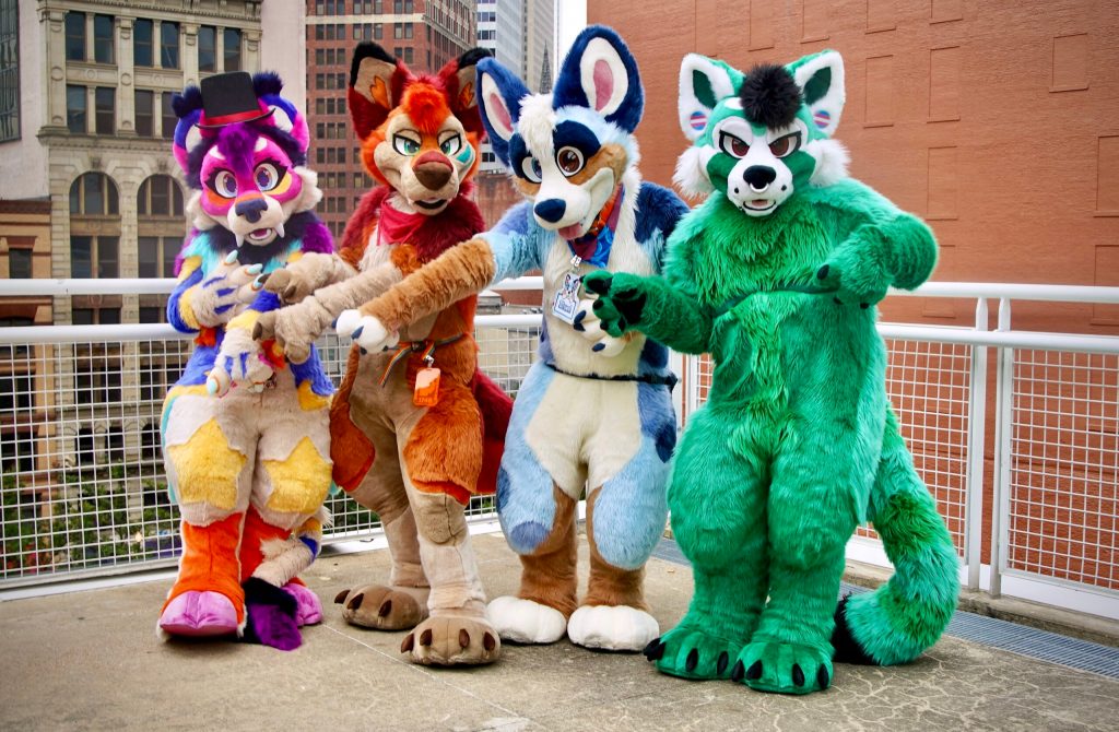 Furries pose for photos at Anthrocon 2023, one of the world's largest anthropomorphic conventions celebrating the furry subculture, in which people dress up or roleplay as animal characters, at the David L. Lawrence Convention Center in Pittsburgh, Pennsy