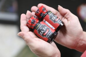 A WOMAN HOLDS BOTTLES OF TIANEPTINE, ALSO KNOWN AS "GAS STATION HEROIN," AT A CONVENIENCE STORE IN JACKSONVILLE, FLORIDA. (OCTAVIO JONES/VICE NEWS)