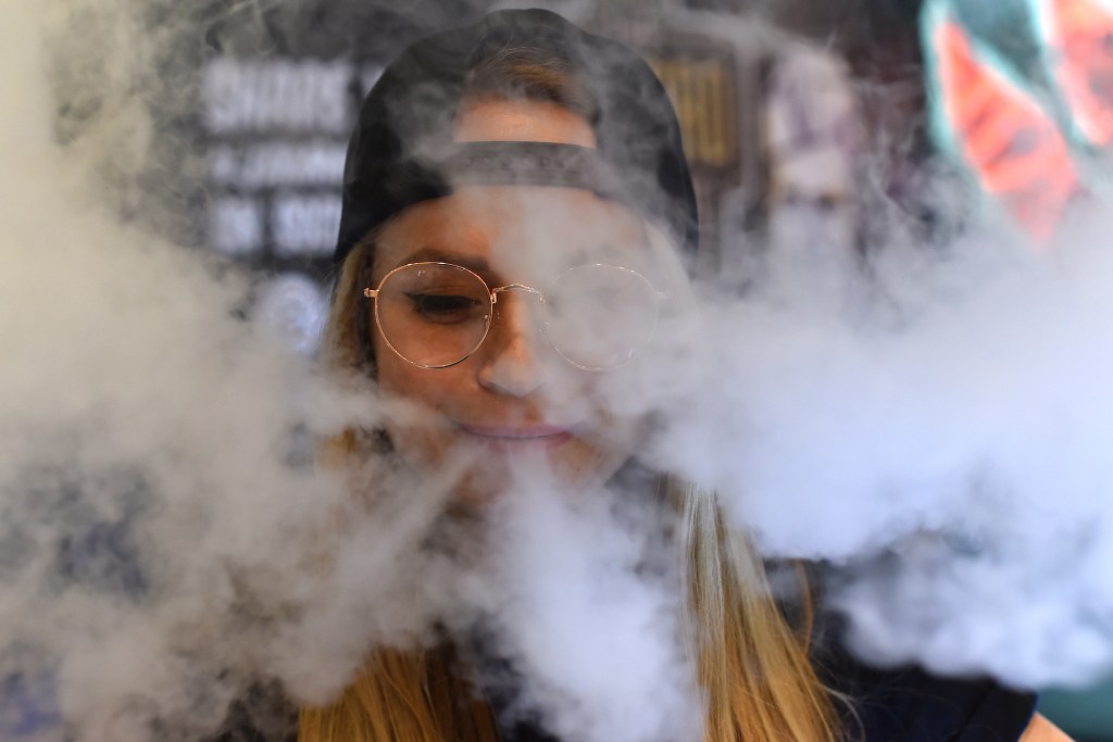 Young woman vaping