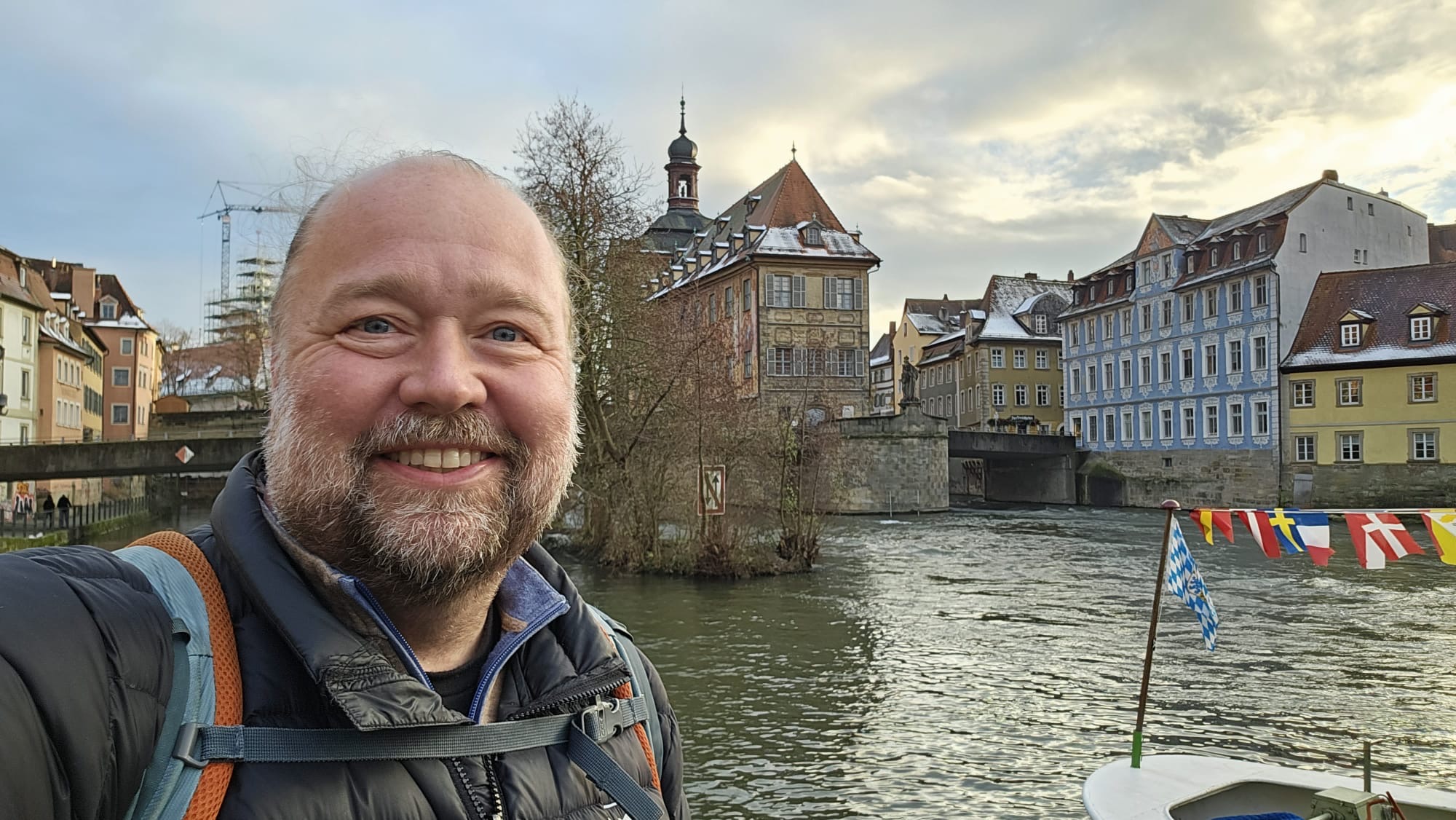 American digital nomad posing for selfie against river