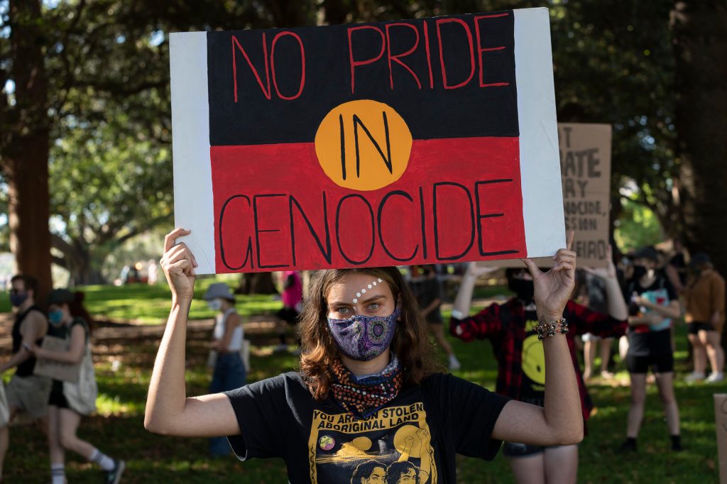 Person holding sign th