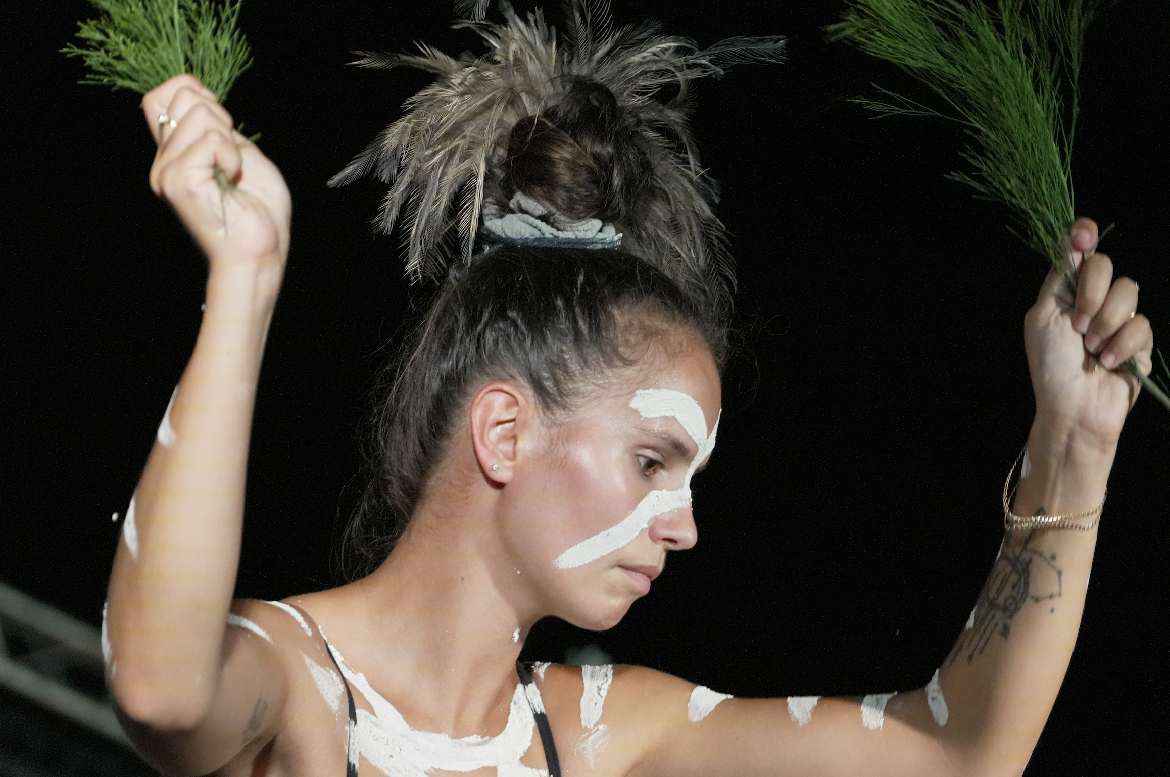 A woman holds fronds