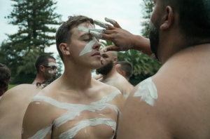 A man has his face painted