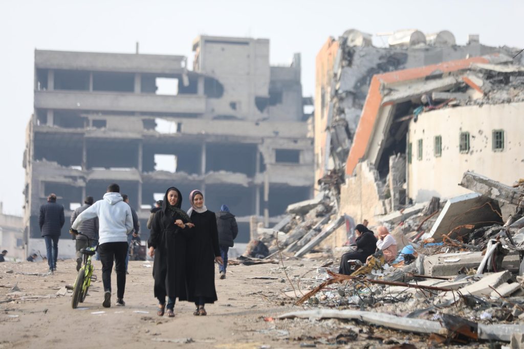 Palestinians return to their neighborhood after the Israeli Forces withdrawn from the Shuja'iyya neighborhood district, inspect the destroyed buildings and roads due to Israeli attacks in Gaza City, Gaza on February 06, 202