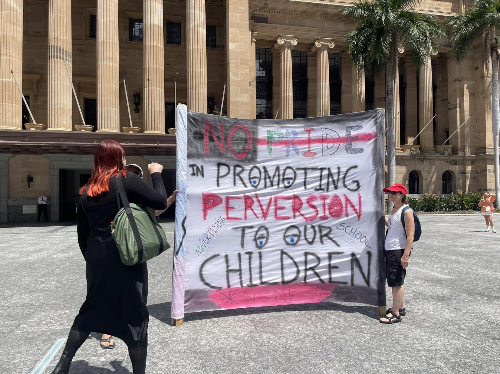 A person confronts an anti-Trans protestor