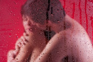 lovers hugging while nude in the shower