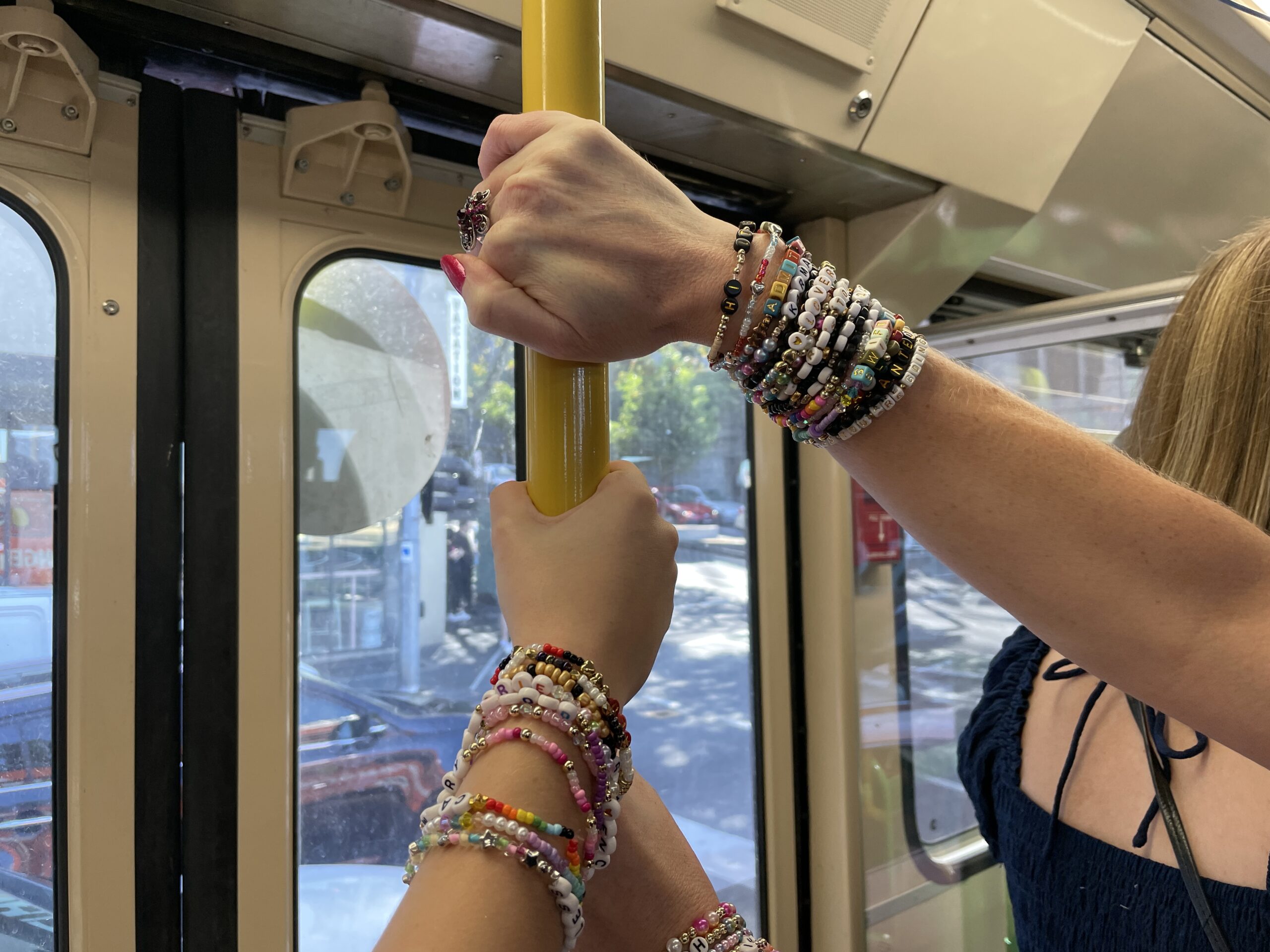 Taylor Swift bracelets on the tram