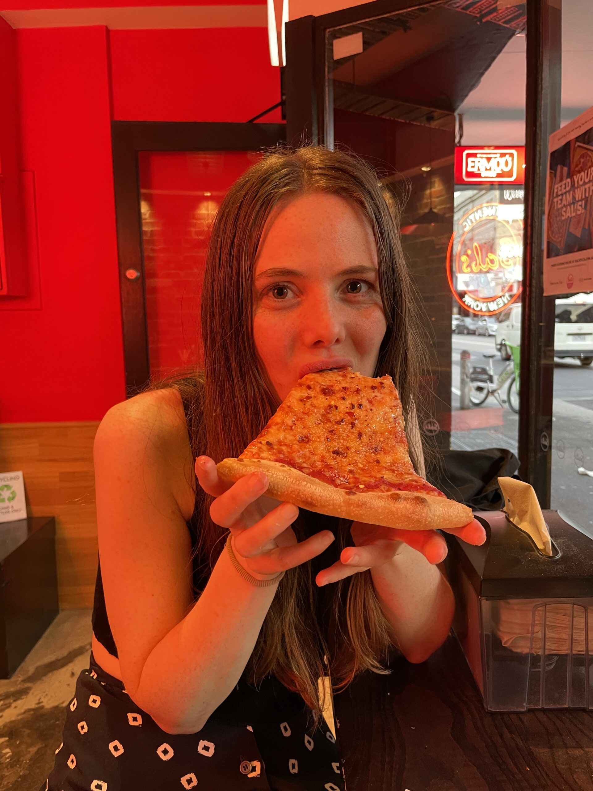 Woman eating pizza