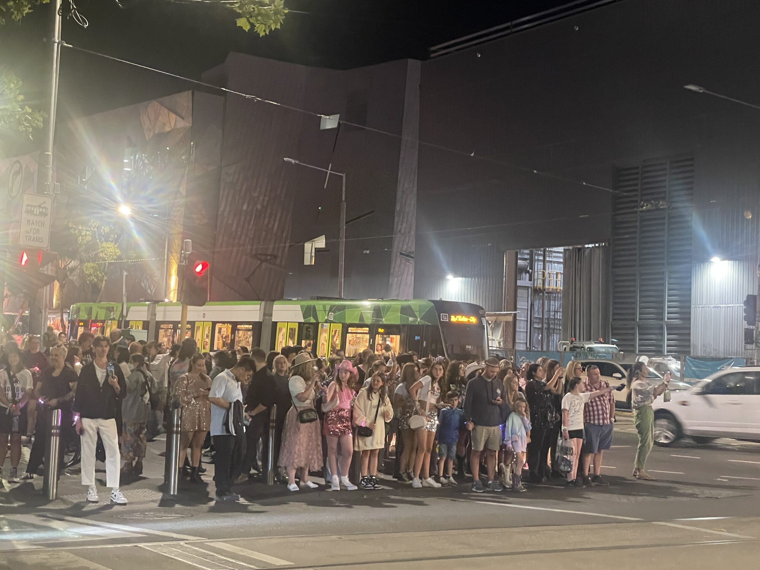 People crowd to cross the road