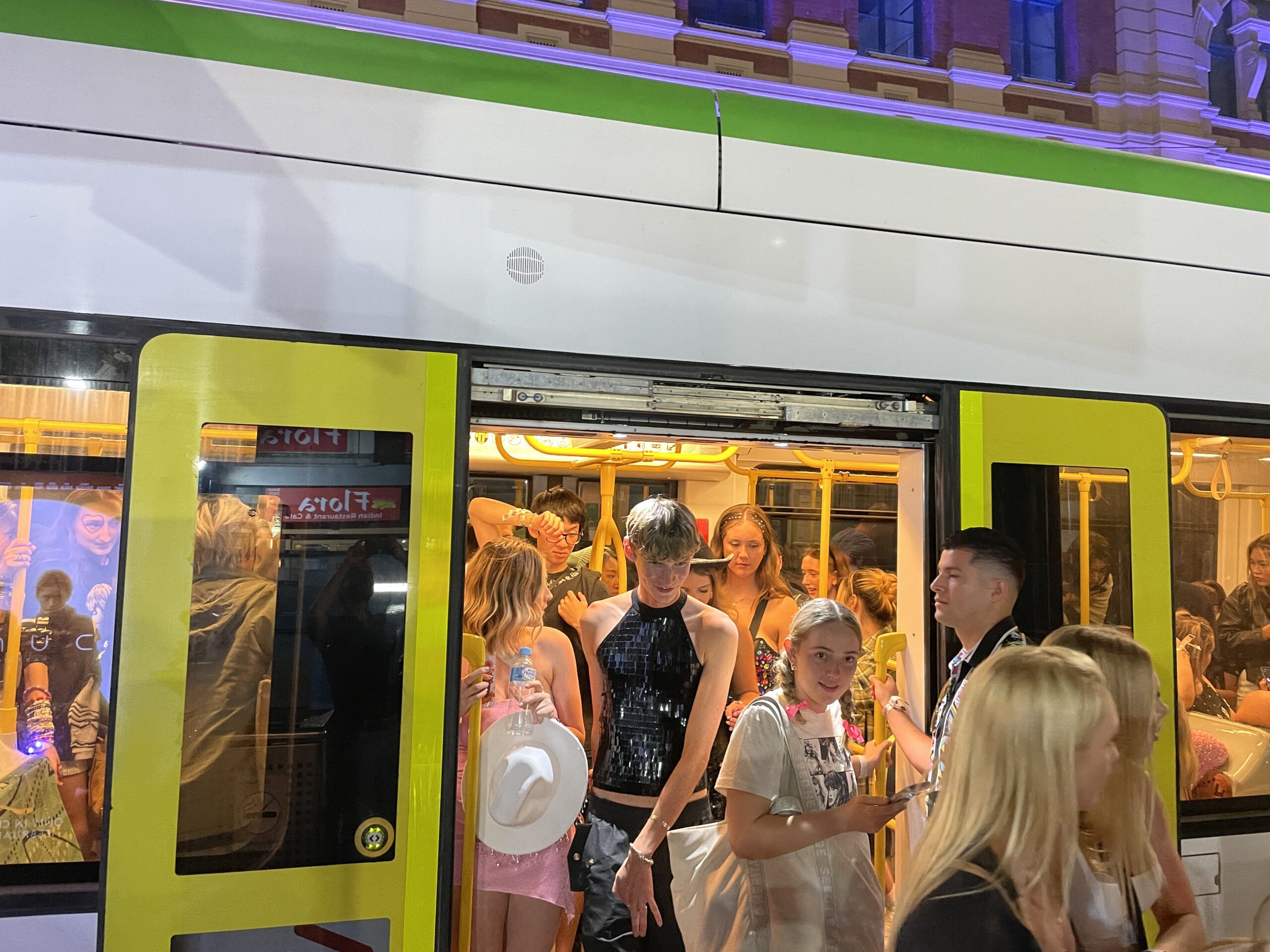 Taylor Swift fans exit a tram