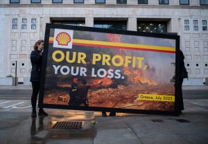 ​Greenpeace activists protest outside Shell HQ in London