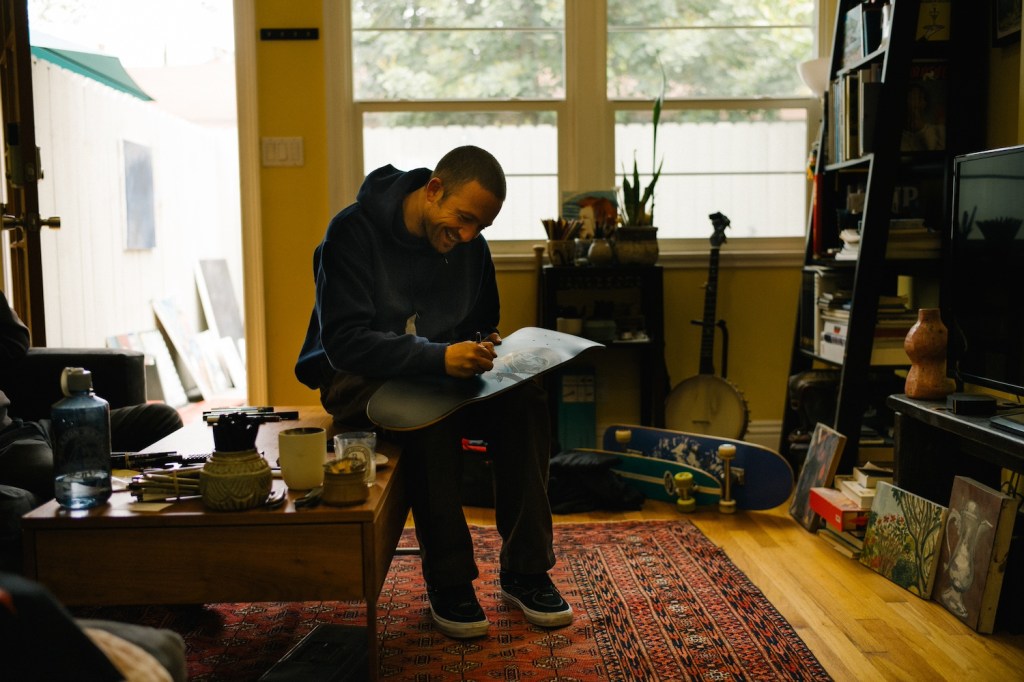 A photo of the skateboarder Mike Gigliotti in a room