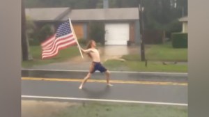 florida man headbanging in a hurricane with american flag