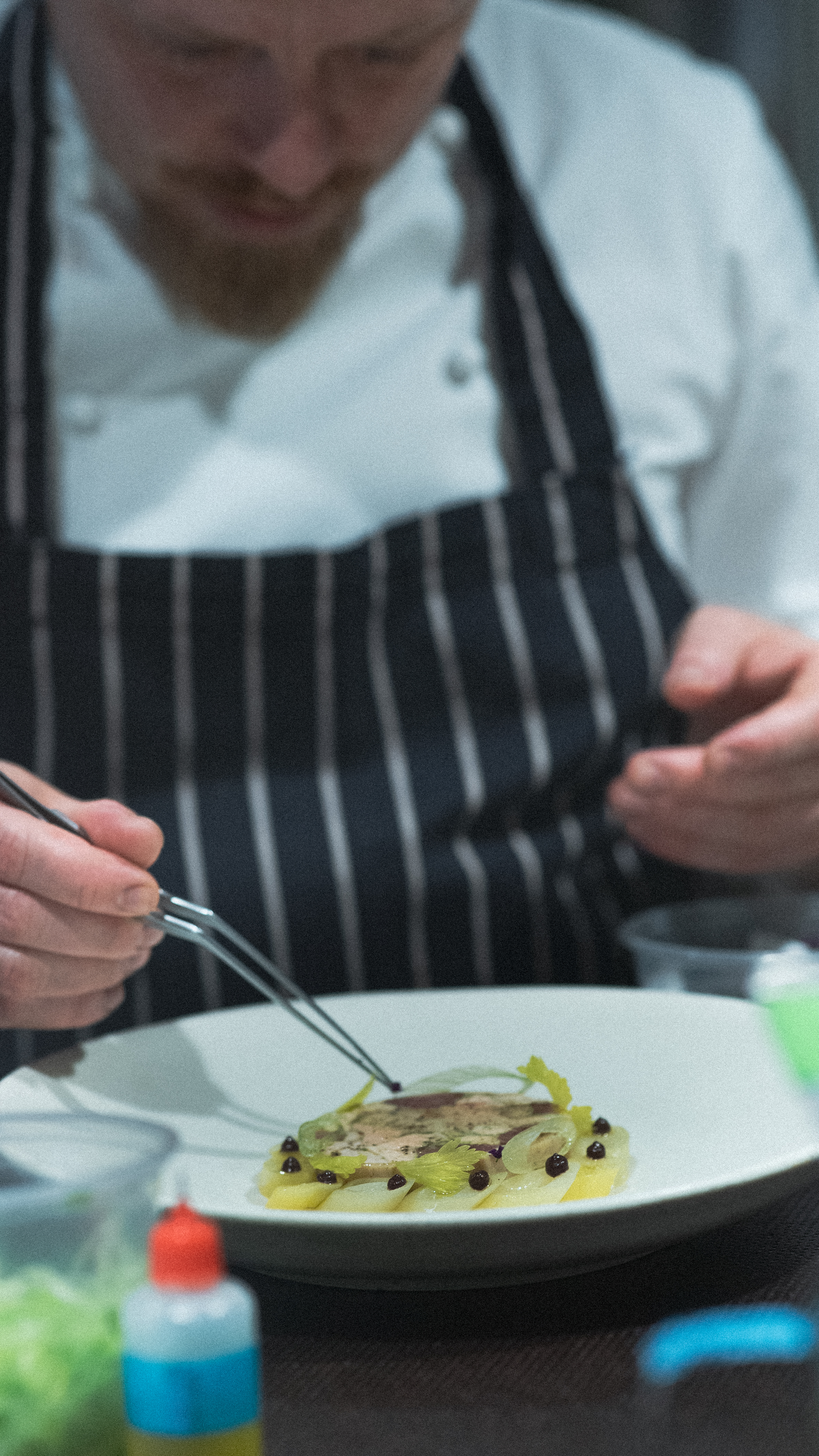 Chef finishes dish in kitchen in Clapham, south-west London.