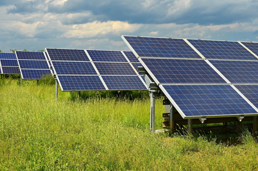 Solar power plant - concept for electricity and ecological industry. High energy prices. Beautiful landscape and sunny day with blue sky. Photovoltaic power plant.; Shutterstock ID 2475074107; purchase_order: vice.com; job: ; client: ; other: