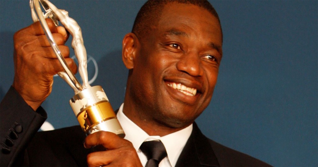 NBA Legend Dikembe Mutombo Dead at 58 Dikembe Mutombo, one of the best shot-blockers in NBA history, died of brain cancer on September 30 at the age of 58. Mutombo’s record of 3,289 blocked shots is the second-highest in NBA history. Mutombo was a 7-foot-2 center who would taunt opposing players with an electrifying and antagonistic finger-wag that he displayed throughout his 18-season career with teams like the Denver Nuggets, Atlanta Hawks, and Philadelphia 76ers. He was primarily known for his lockdown defense, having won the NBA Defensive Player of the Year award four times and earning eight All-Star selections throughout his career. At his peak, Mutombo averaged 4.5 blocks per game. He led the league in rebounds and blocks multiple times throughout his career. In an iconic Adidas commercial, Mutombo famously declared that “Man cannot fly in the house of Mutombo.” https://www.youtube.com/watch?v=xG0gxDjjPto Born in Kinshasa, Congo, Mutombo moved to the United States to study at Georgetown University, where he majored in linguistics and diplomacy. There, he interned at Congress and the World Bank. Mutombo was unsure if he should enter the NBA until Georgetown head coach John Thompson introduced Mutombo to NBA legend Bill Russell, who convinced Mutombo he could play in the league. He received his bachelor’s degree the same year he was drafted. Soon, Mutombo transformed from a student into a basketball star known for his shot-blocking prowess. He left his mark on the game immediately, helping the Denver Nuggets go on an impressive playoff run in 1994, upsetting the one-seeded Seattle Supersonics in the first round of the playoffs as an eighth seed. It was the first time in NBA history that an eighth-ranked team had beaten a one-seed. For as transformative as he was on the court, Mutombo will be remembered for his philanthropic efforts around the world. Mutombo would lead basketball clinics back in his home country. He paid for the national women’s basketball team to travel to the 1996 Olympics in Atlanta. Through his foundation, he oversaw the construction of a 300-bed hospital in his hometown of Kinshasa in 2007.