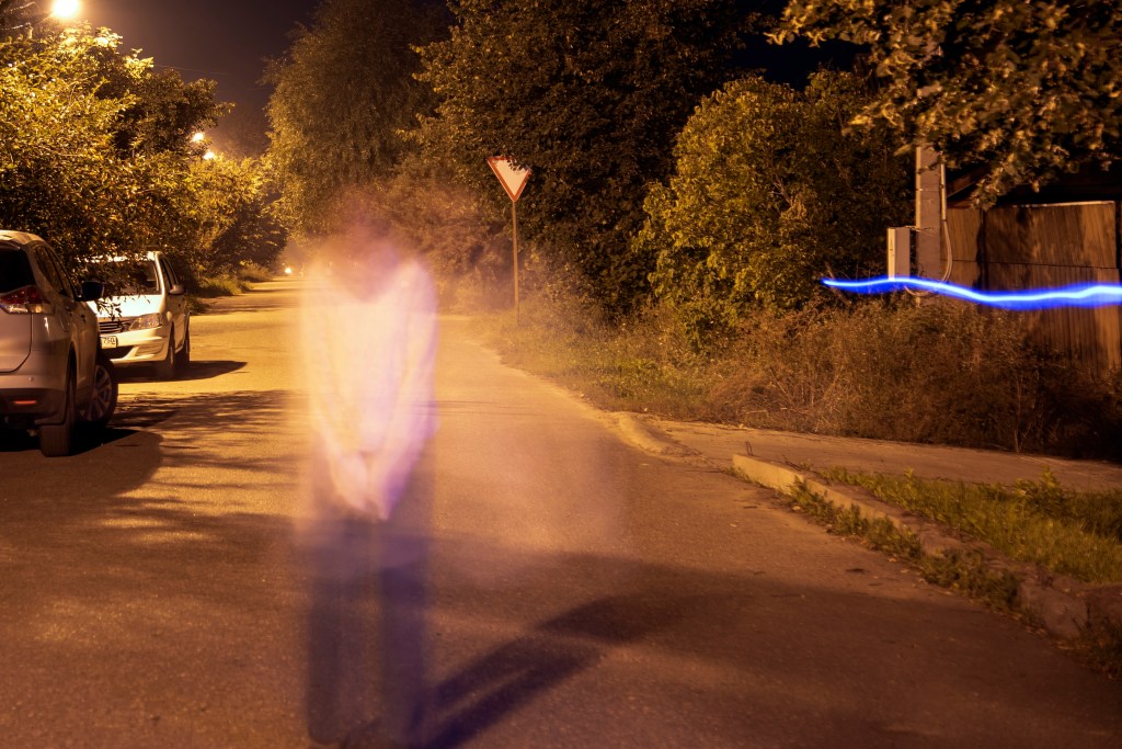 long exposure taken at night of a ghostly person