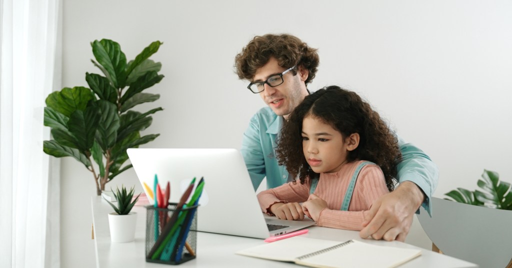 dad and daughter on computer