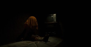 A small boy in front of a TV in The Cabin Factory