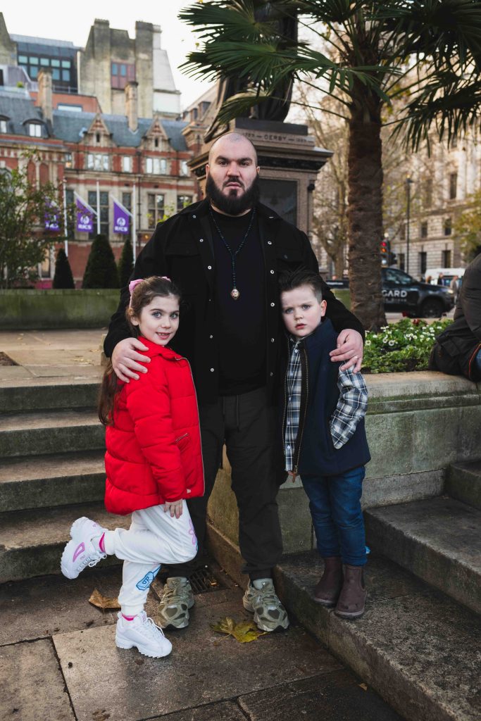 John 'JR' Riley, founder of the Gypsy Traveller League, protests with his children at a demonstration pushing for greater respect for the UK's Gypsy, Roma and Traveller communities, in central London in November 2024