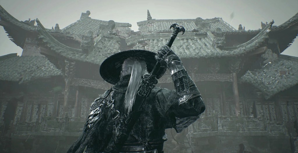 The main character of Phantom Blade Zero holding his sword in his right hand, standing in front of a temple.